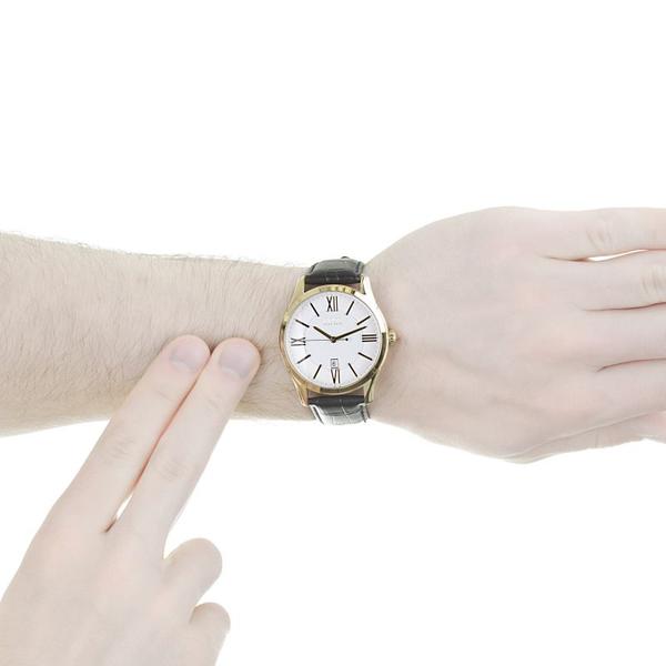 Hugo Boss men's watch on wrist showing white dial and black leather strap