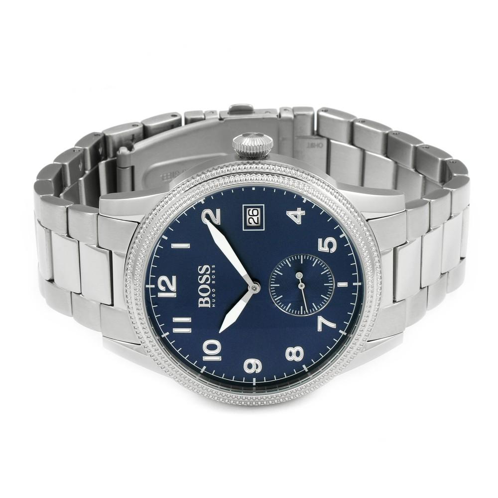 Hugo Boss watch at angle showing blue dial, silver bracelet, date window and subdial detail