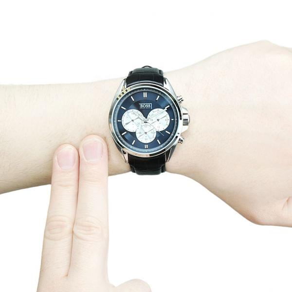Hugo Boss men's chronograph watch on wrist with black leather strap and blue dial