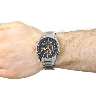 Hugo Boss Grand Prix chronograph on wrist showing black dial with three subdials and two-tone bracelet