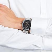 Hugo Boss Grand Prix chronograph watch worn on wrist with black dial and mixed metal bracelet