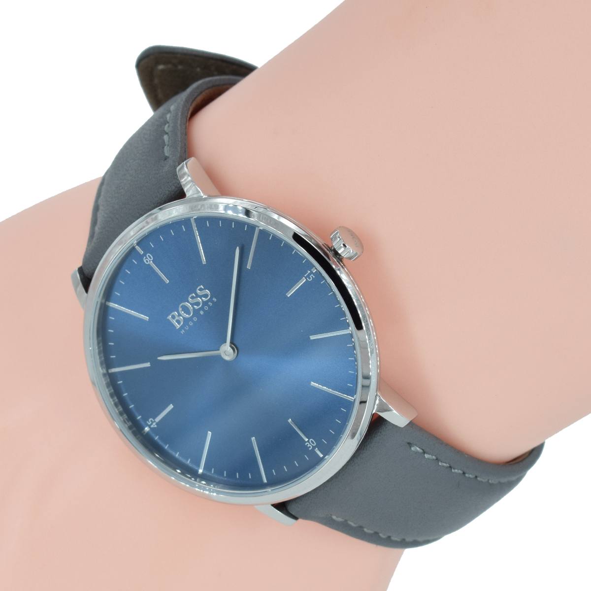 Hugo Boss Horizon blue dial watch worn on wrist with gray leather strap