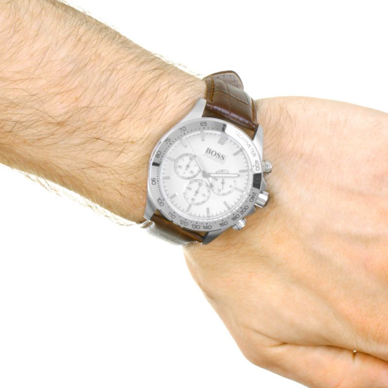Hugo Boss Ikon chronograph watch on wrist showing white dial and brown strap