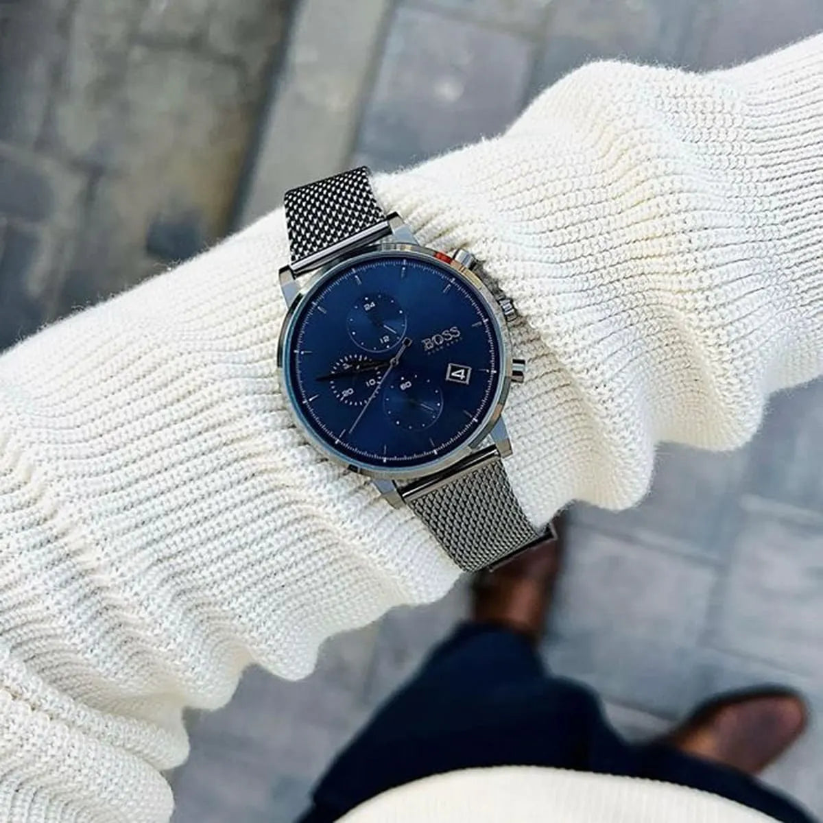 Hugo Boss Integrity chronograph watch worn on wrist with blue dial and mesh bracelet