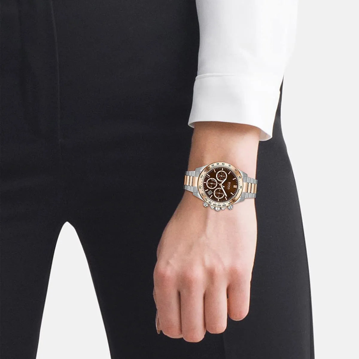 Hugo Boss Novia chronograph watch worn on wrist showing brown dial and two-tone stainless steel bracelet