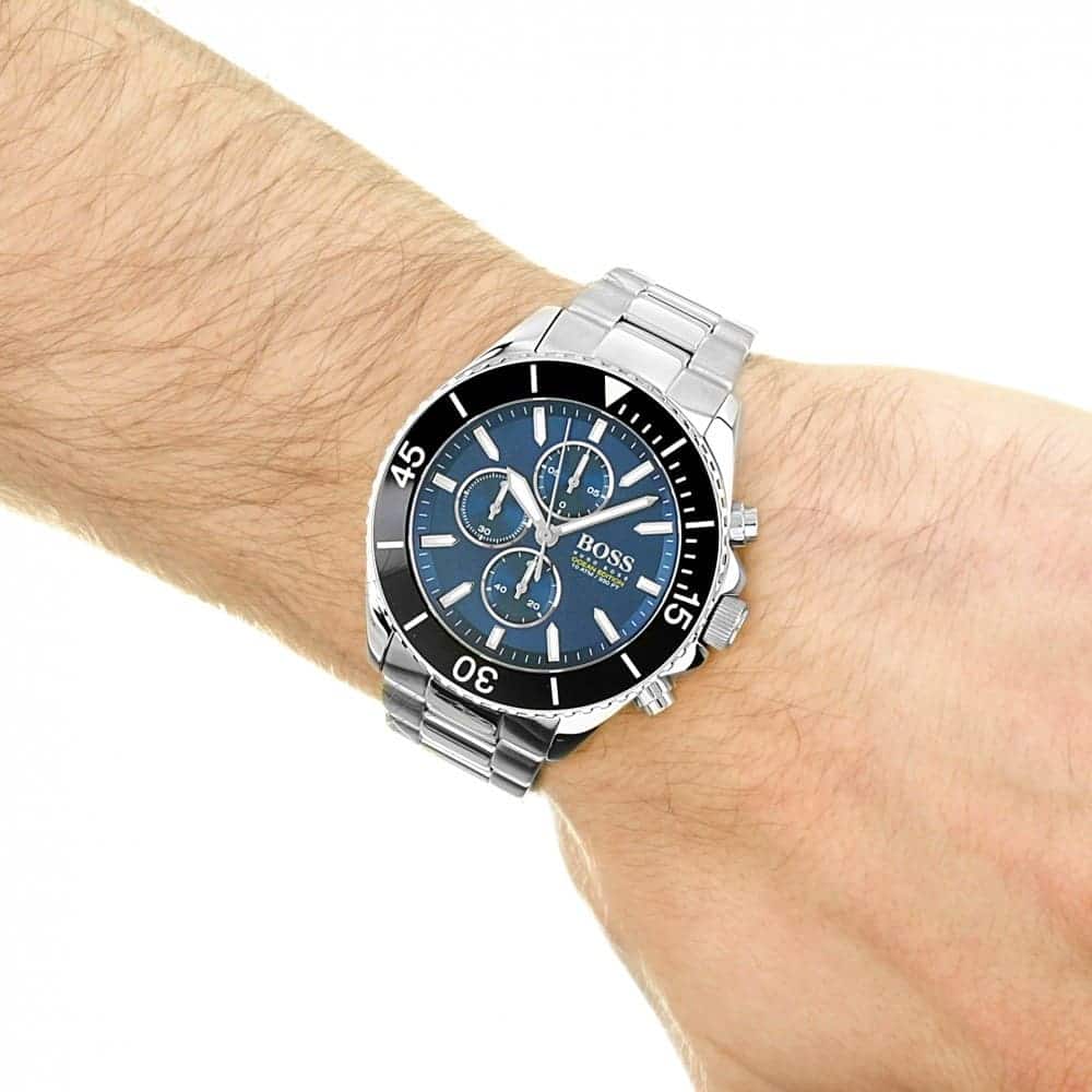 Hugo Boss Ocean Edition chronograph watch worn on wrist showing blue dial and steel bracelet