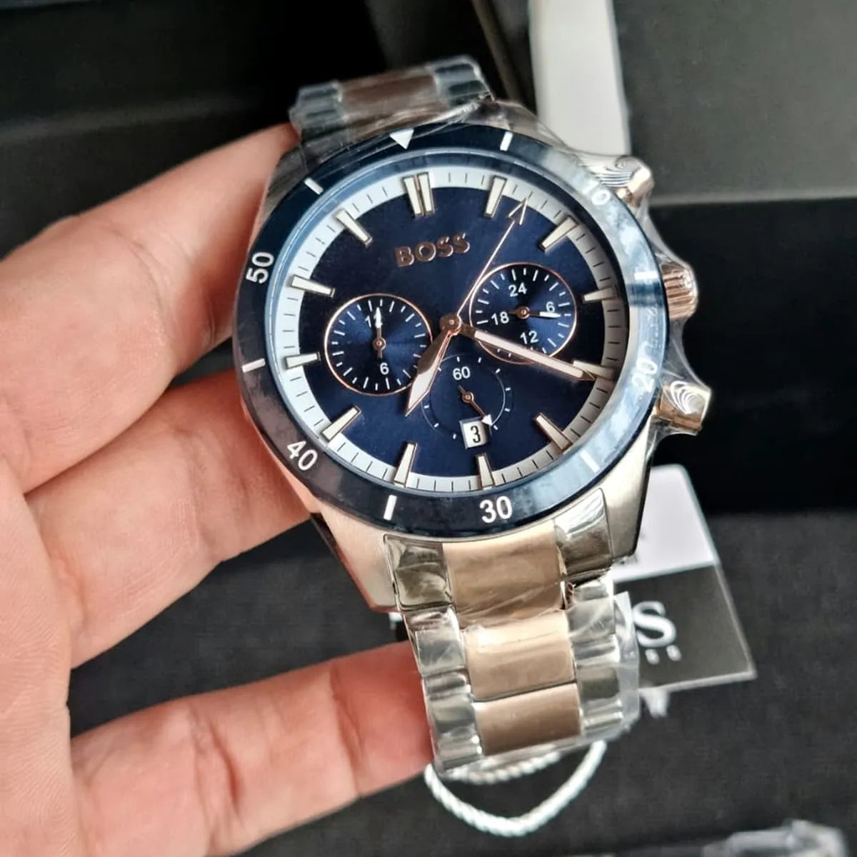 Hugo Boss Santiago chronograph watch in hand showing dial with BOSS branding and subdials