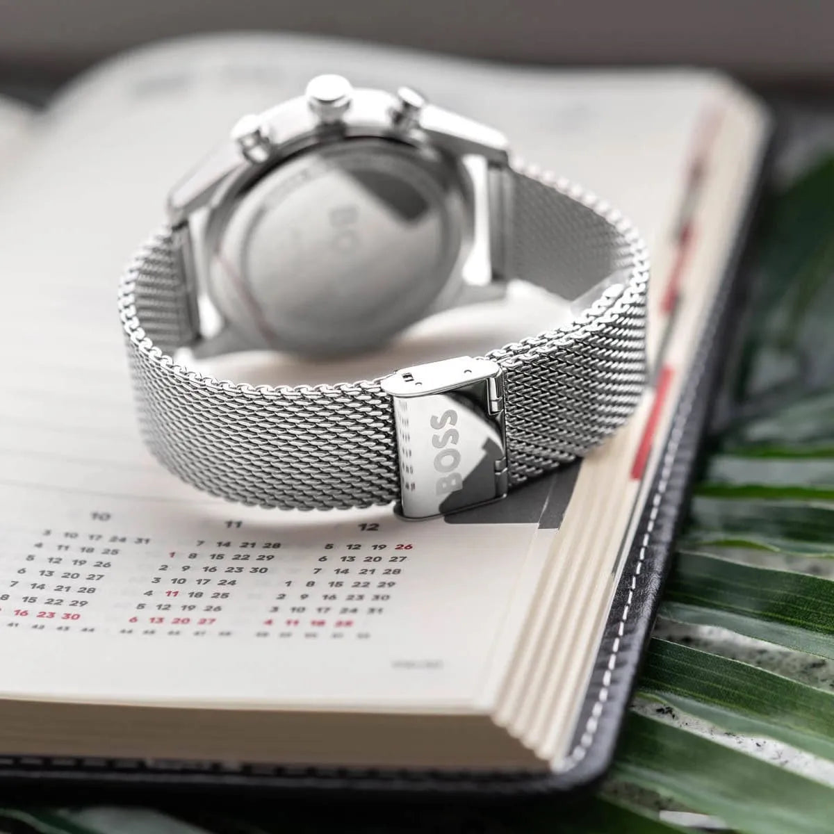 Hugo Boss Strike watch side view showing stainless steel case and mesh band thickness