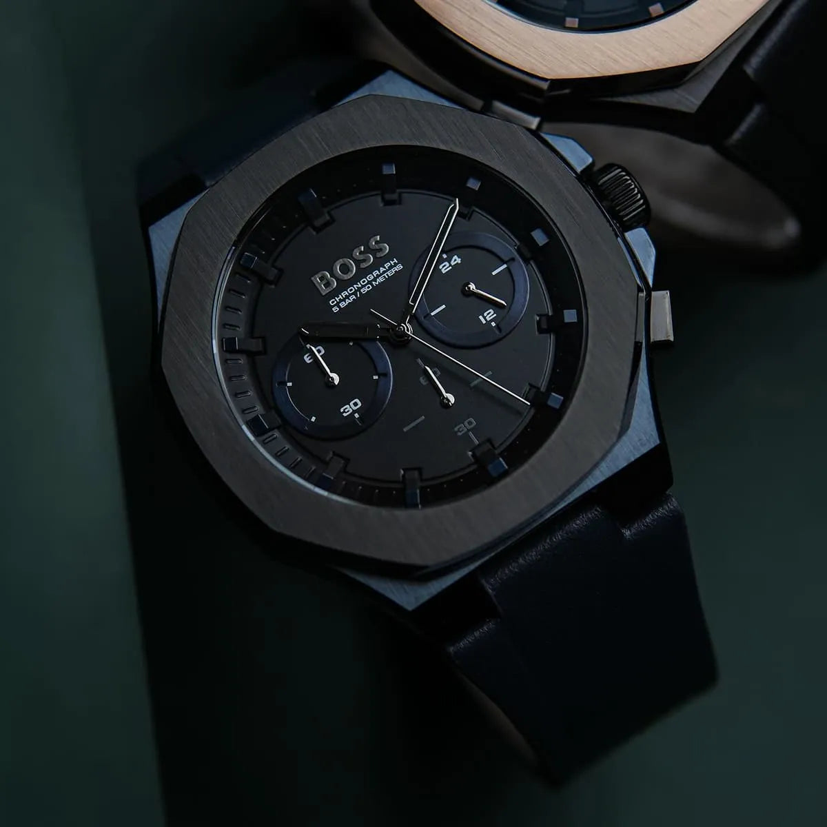 Hugo Boss Taper chronograph watch flat lay detail shot showing black dial