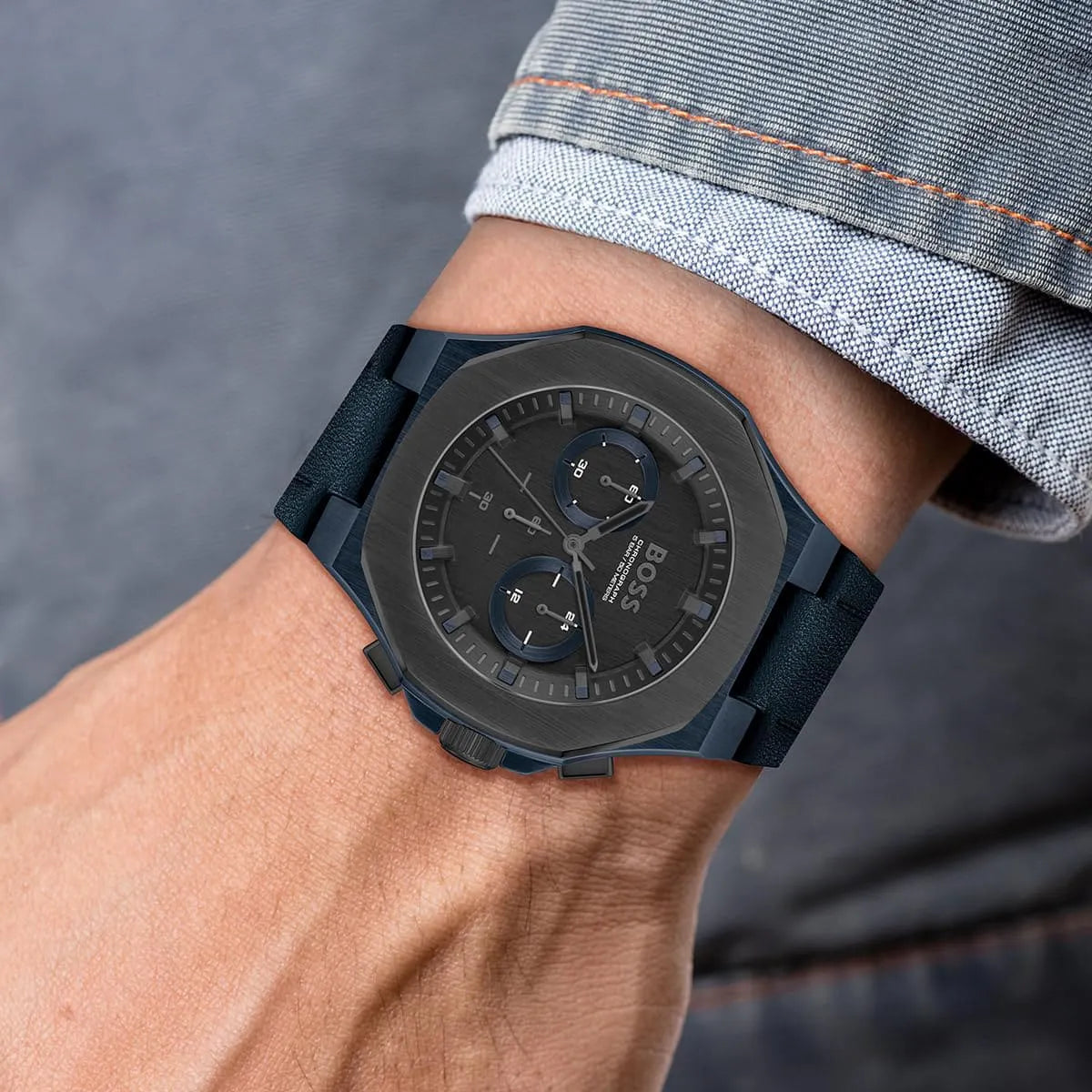 Hugo Boss Taper chronograph watch worn on wrist with blue rubber strap
