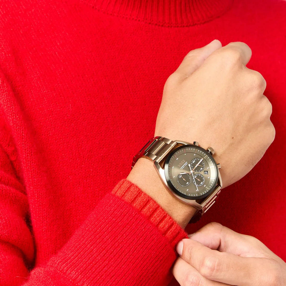 Hugo Boss Top chronograph watch worn on wrist against red sweater