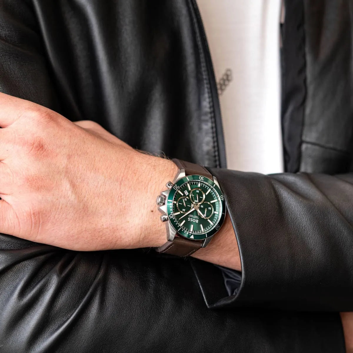 Hugo Boss Troper men's chronograph watch worn on wrist with green dial visible