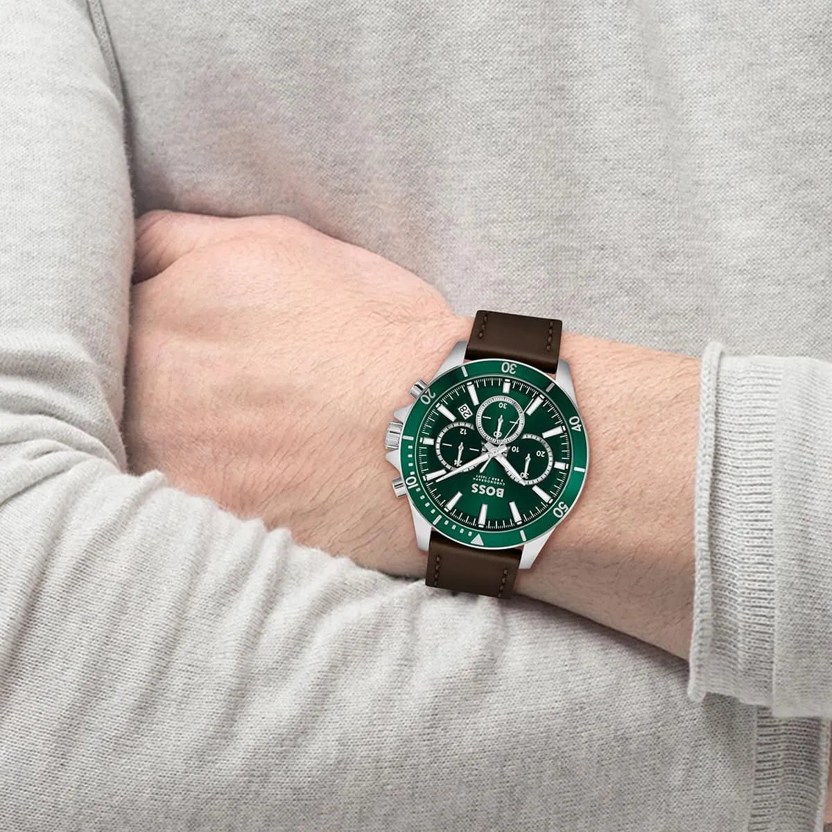 Hugo Boss Troper chronograph watch on wrist showing green dial and brown leather strap
