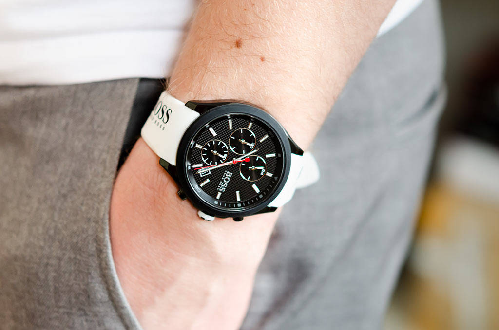 Hugo Boss Velocity black dial chronograph watch worn on wrist with white strap