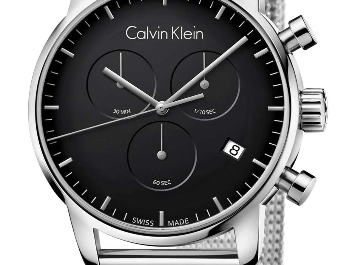 Close-up of black dial showing three chronograph sub-dials and date window