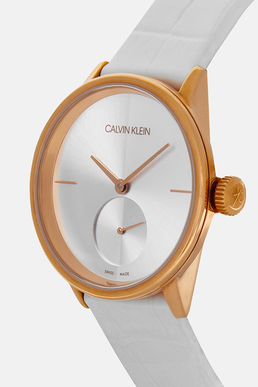 Side view of Calvin Klein Accent watch with rose gold crown and white leather strap