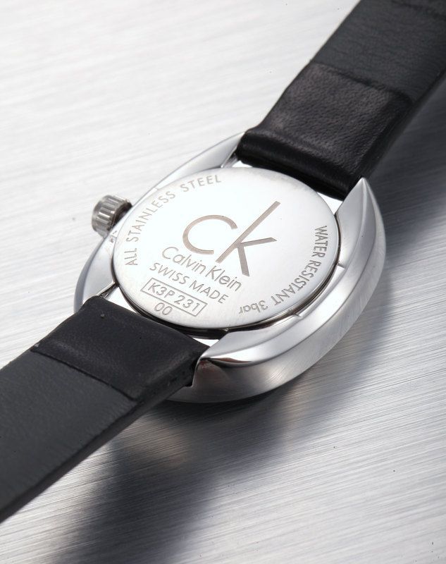 Calvin Klein Incentive watch caseback showing stainless steel with engraved branding