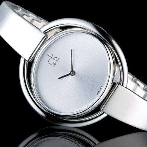 Close-up of Calvin Klein Impetuous K4F2N116 silver dial with hands and branding