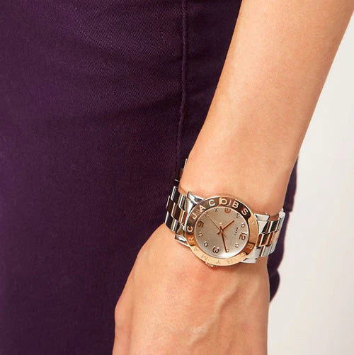 Marc by Marc Jacobs Blade watch worn on wrist with white dial and rose gold accents