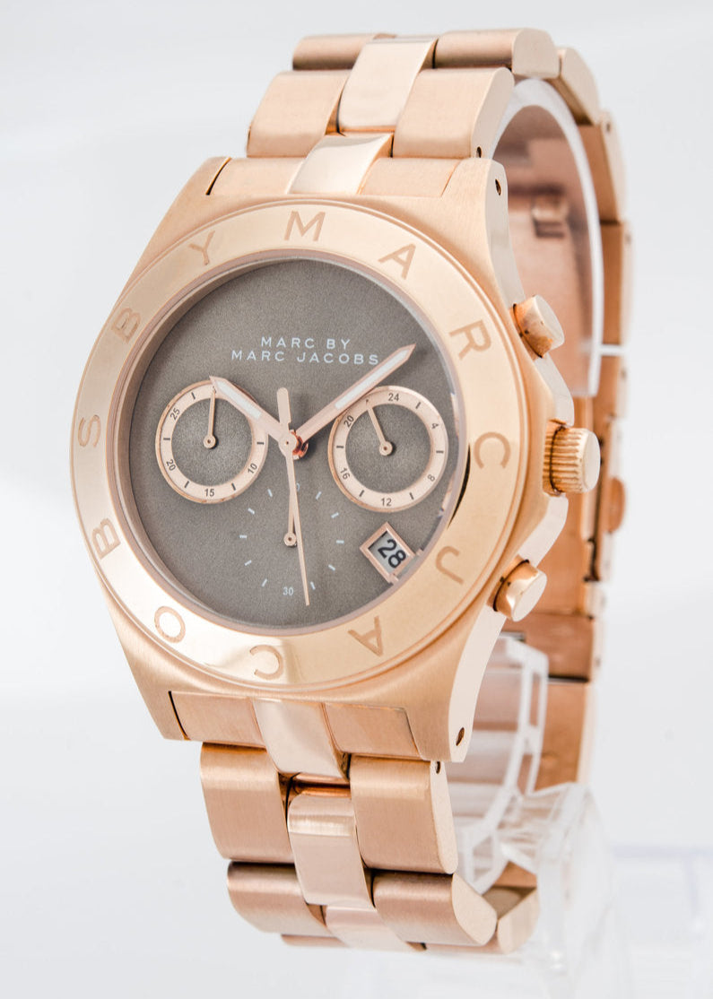Angled view of rose gold chronograph watch with brown dial and dual sub-dials
