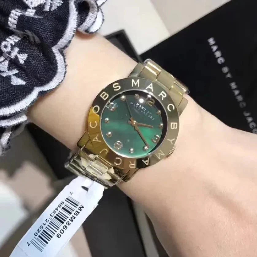 Marc by Marc Jacobs MBM8609 watch on wrist, styled with accessory and packaging visible