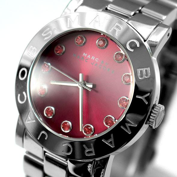 Close-up of Marc Jacobs Amy watch face with red dial and sparkling crystal indices