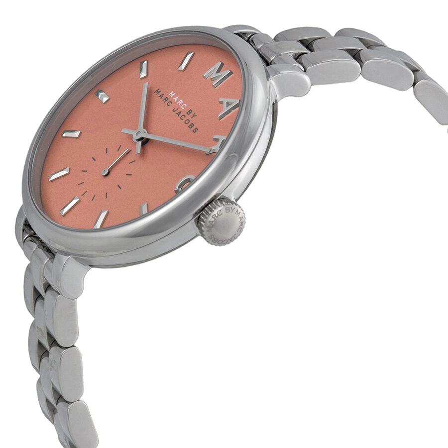 Slim Baker watch at angle showing orange dial and stainless steel bracelet with crown