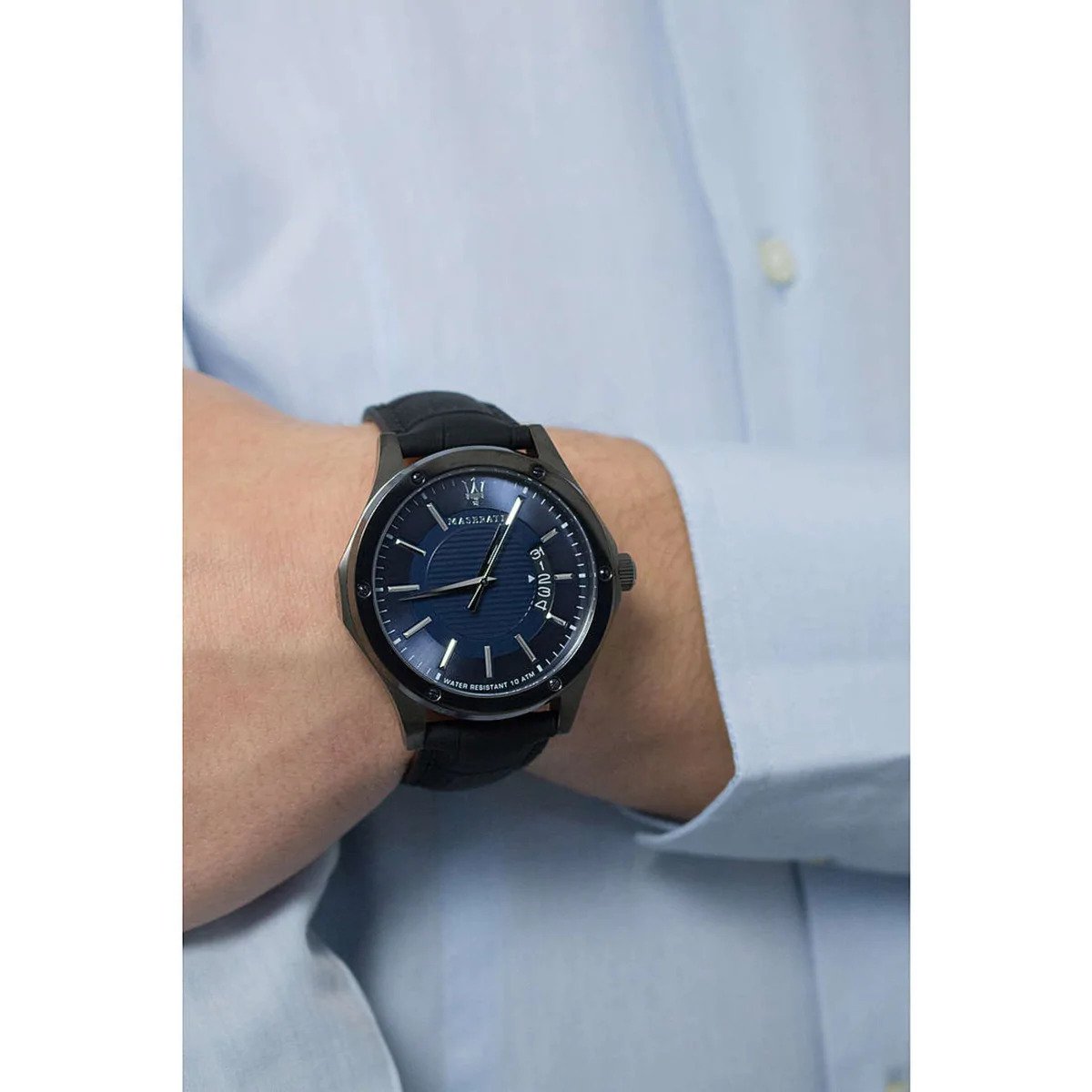 Maserati Circuito watch worn on wrist with blue dial visible against light blue shirt