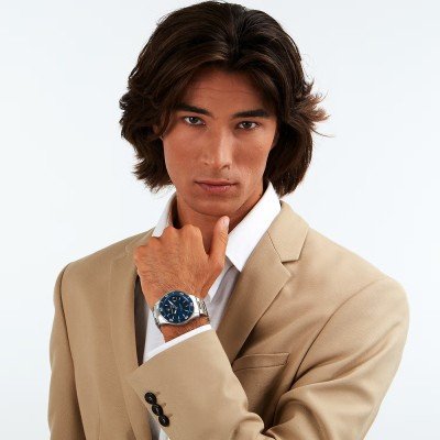 Maserati Competizione diver watch worn on wrist with blue dial and stainless steel bracelet