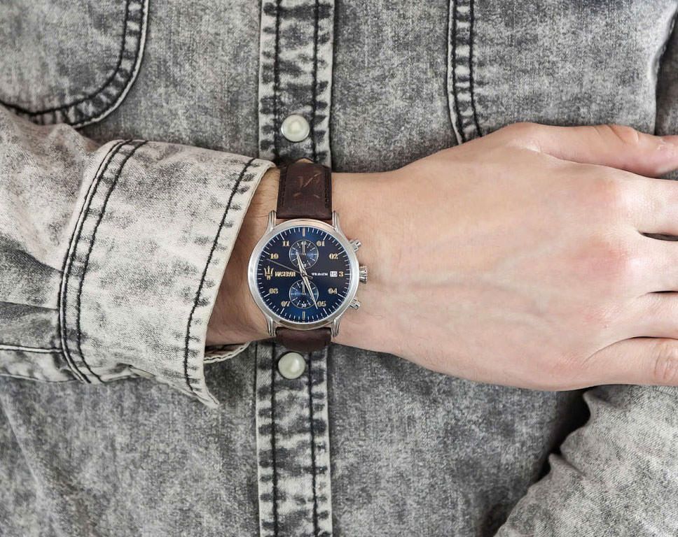 Maserati Epoca chronograph watch worn on wrist with blue dial and brown leather strap