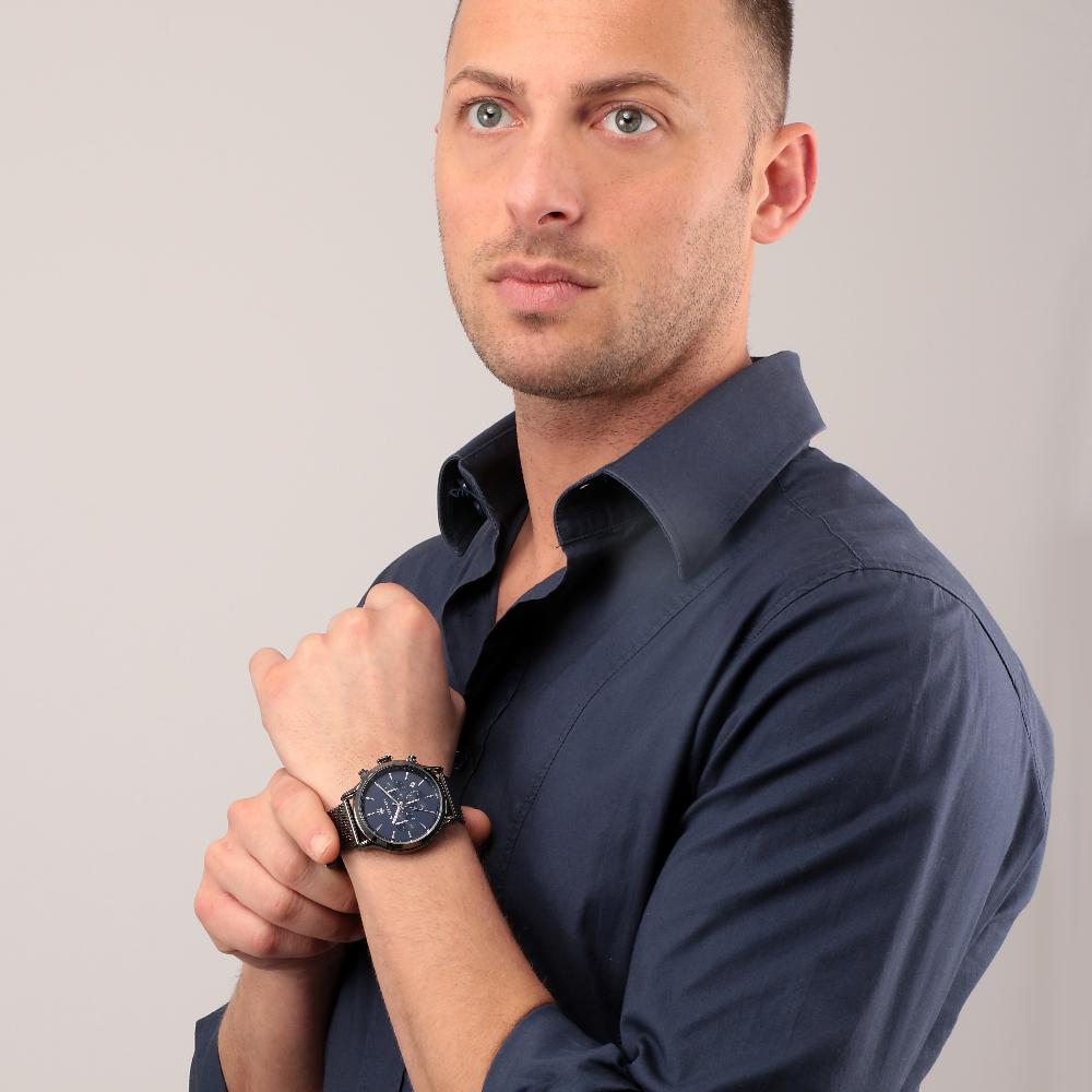 Maserati Epoca chronograph watch worn on wrist by man in navy shirt