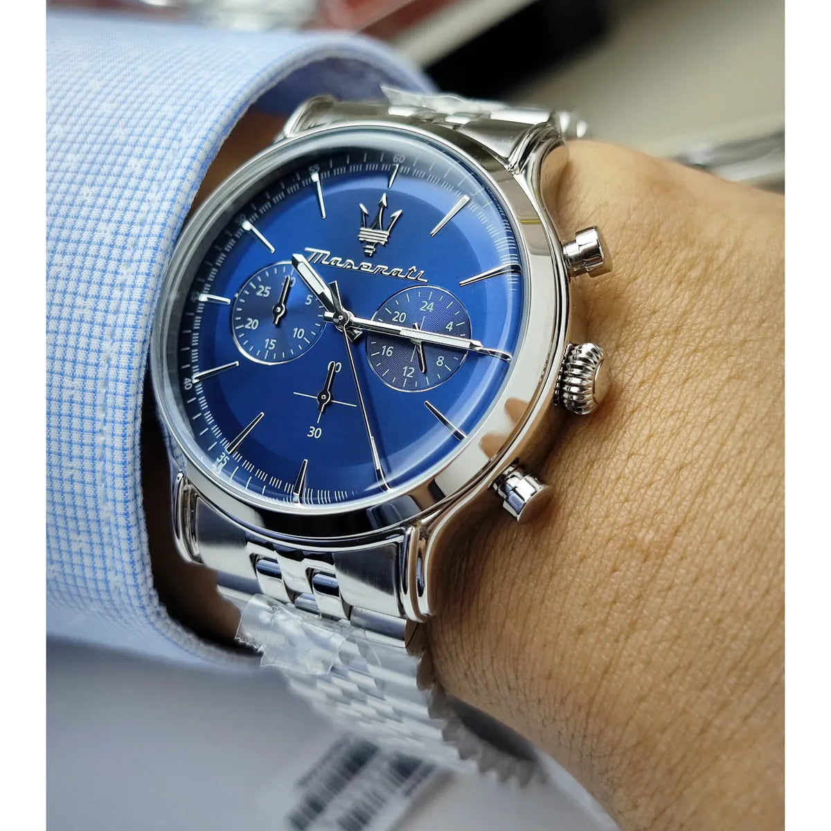 Maserati Epoca chronograph watch on wrist with blue dial and stainless steel bracelet