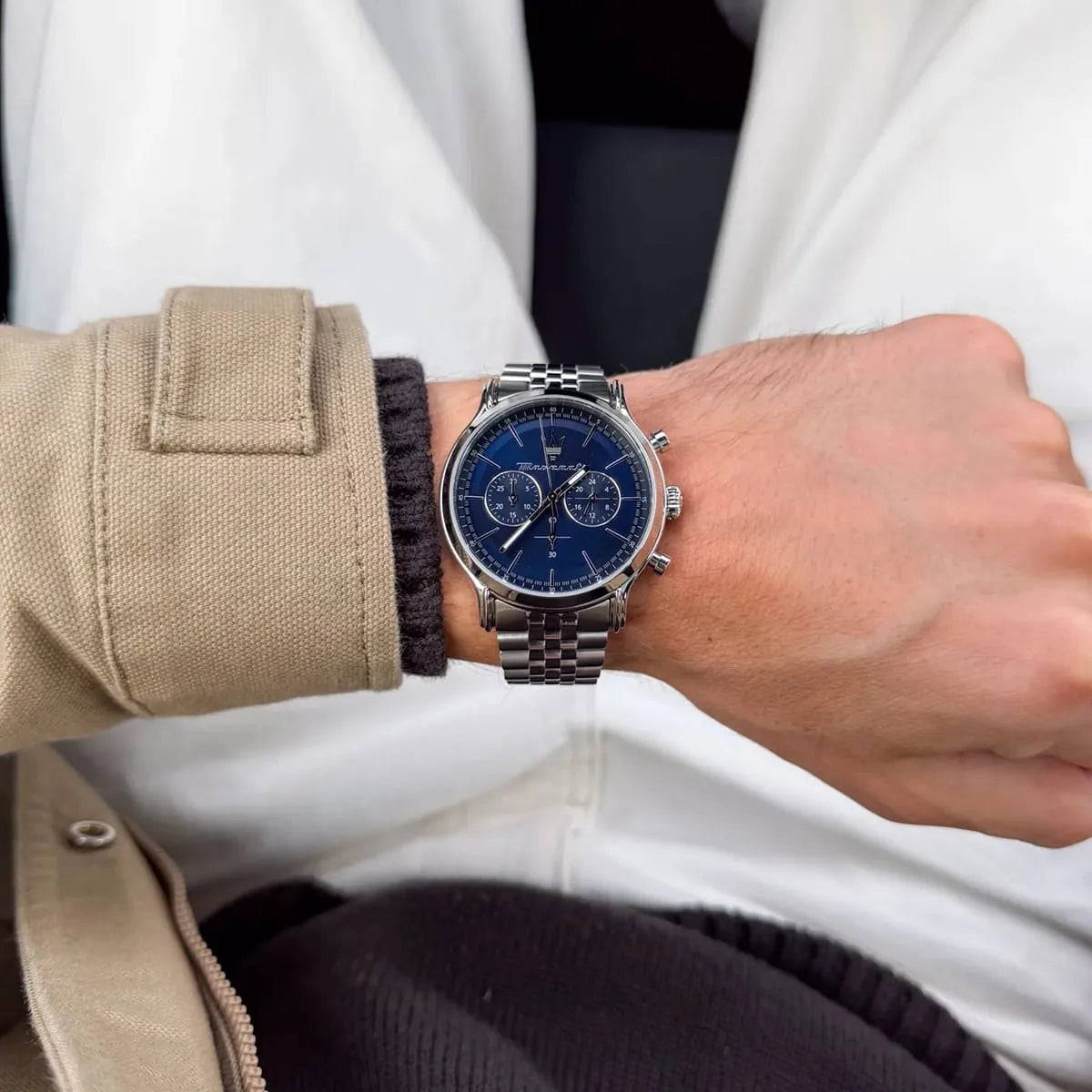 Maserati Epoca blue dial chronograph watch on wrist with stainless steel bracelet
