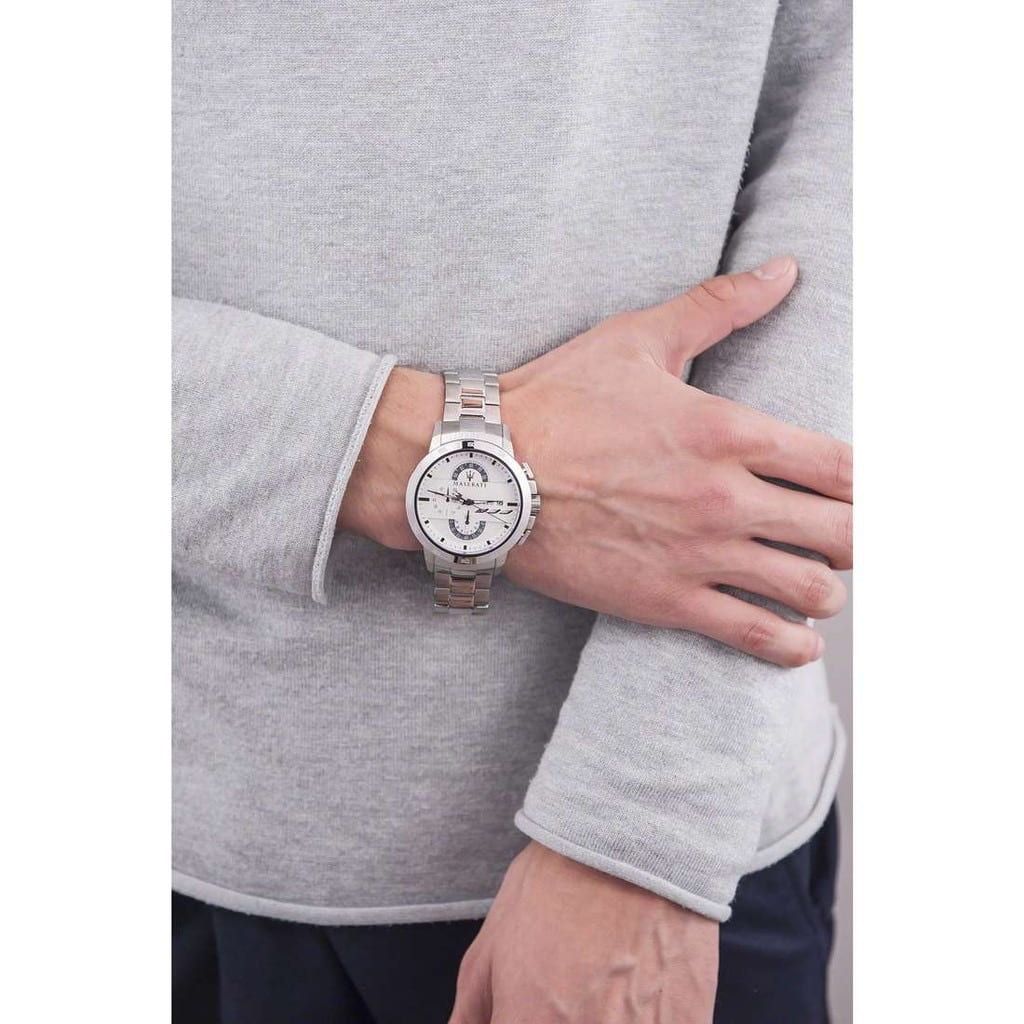 Maserati Ingegno chronograph watch worn on wrist with silver dial and steel bracelet