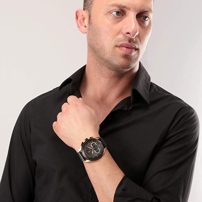 Maserati chronograph watch worn on wrist with black dial and gold-tone case