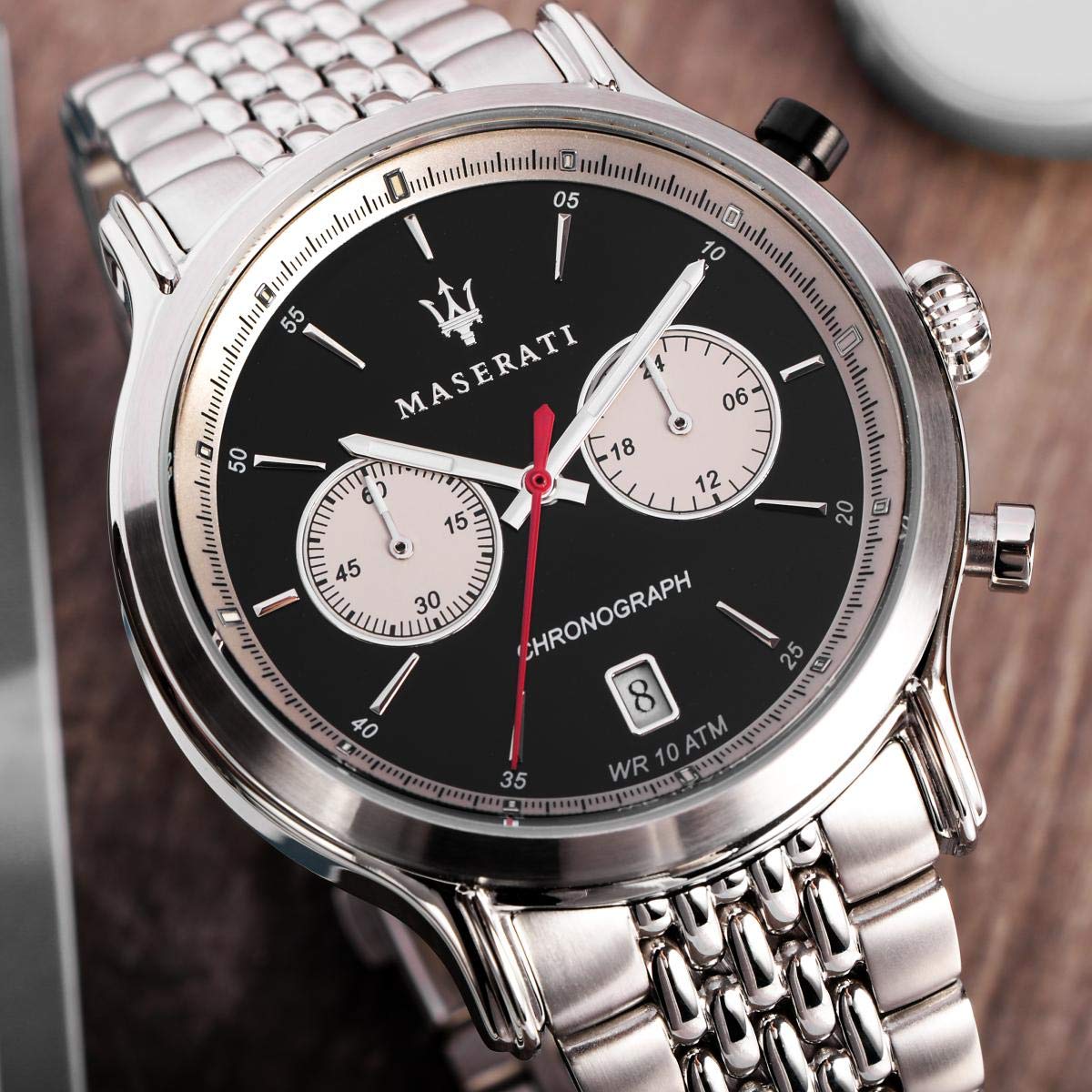 Close-up of Maserati chronograph dial with black face, subdials, and red chronograph hand