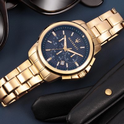 Angled view of Maserati Successo chronograph with black dial and gold-tone bracelet