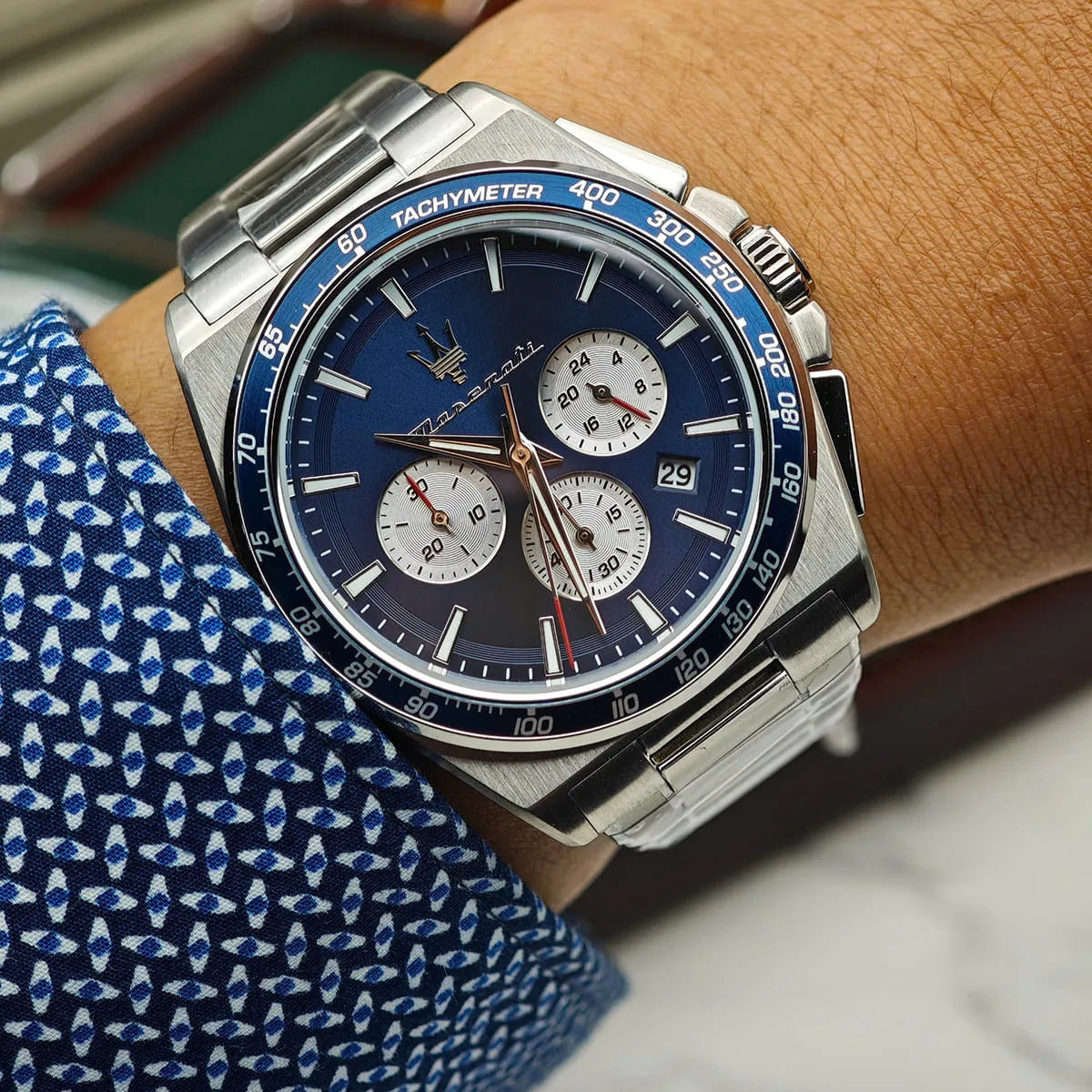 Maserati Velocità R8873652005 chronograph watch worn on wrist, blue dial with tachymeter bezel visible