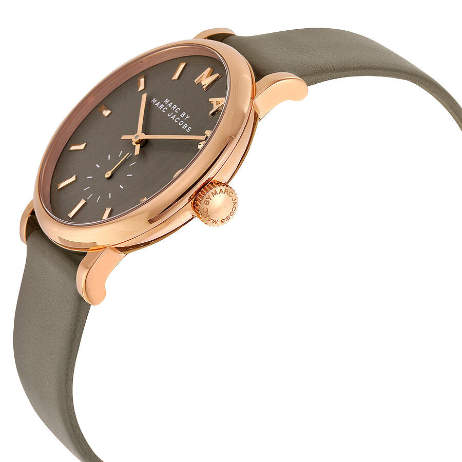 Angled view of Baker watch showing rose gold case and grey leather strap