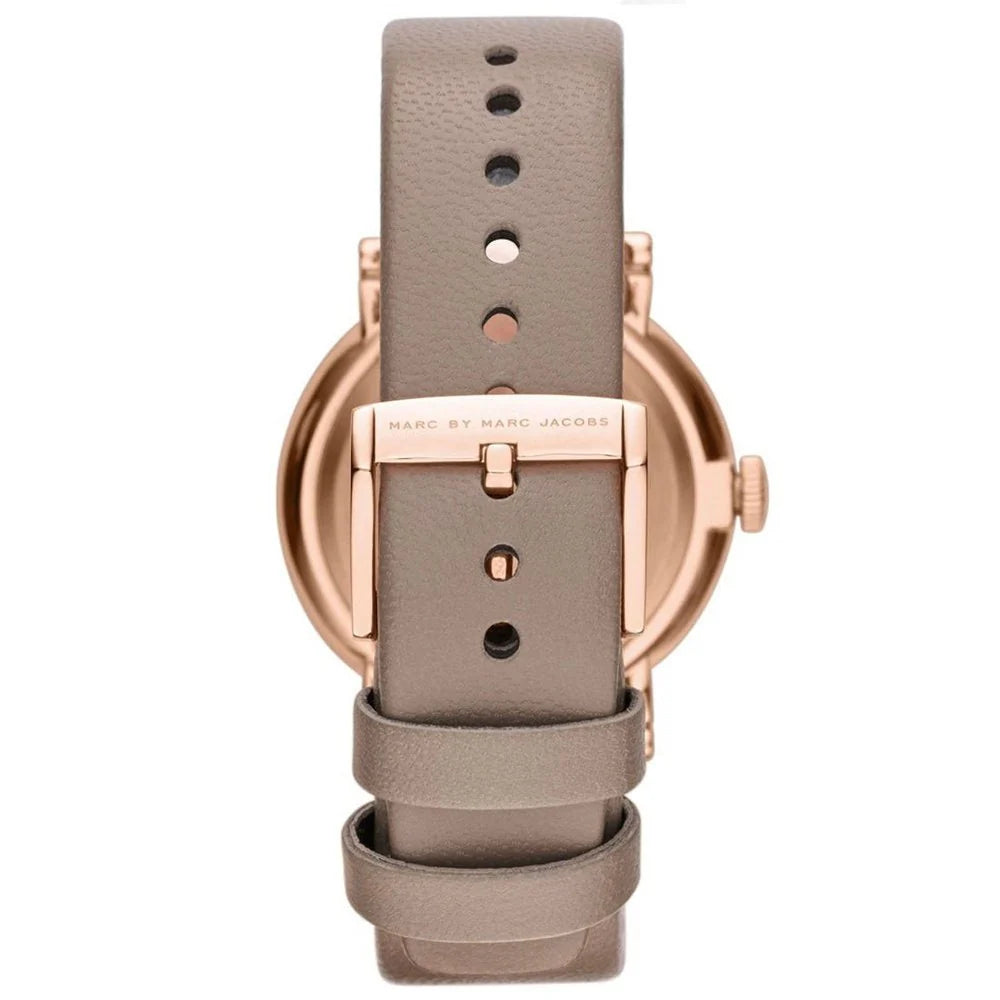 Close-up of grey leather strap with rose gold buckle and adjustment holes