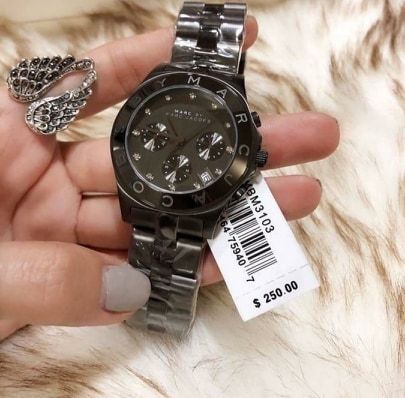 Marc by Marc Jacobs Blade black chronograph watch worn on wrist with retail tag visible