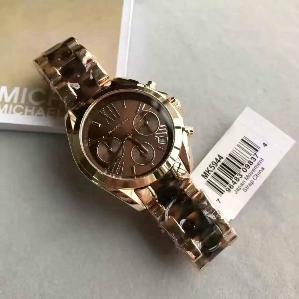 Bradshaw MK5944 chronograph watch displayed with care tag on brown cushion