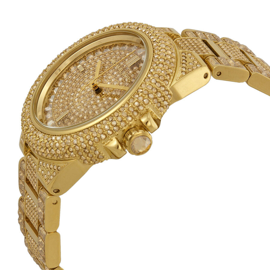 Side angle view of Michael Kors Camille gold watch showing crystal details and pushers