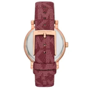Michael Kors Corey watch caseback showing rose gold case and red quilted leather strap
