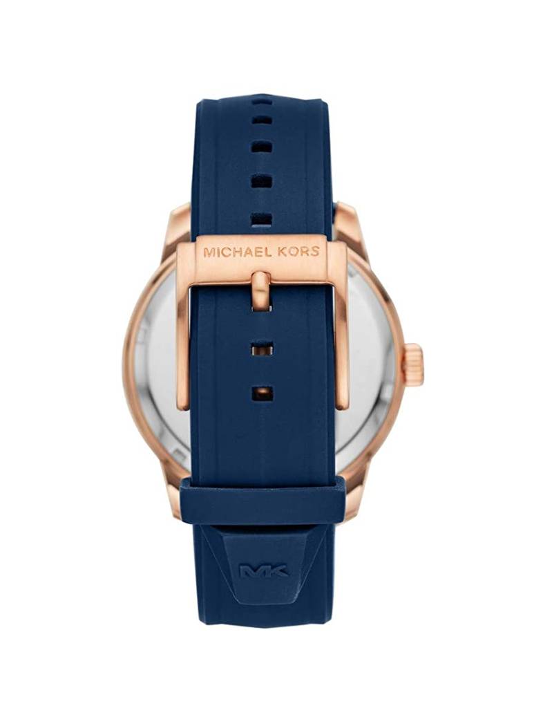 Caseback view of Michael Kors Cunningham watch with rose gold case and blue silicone strap