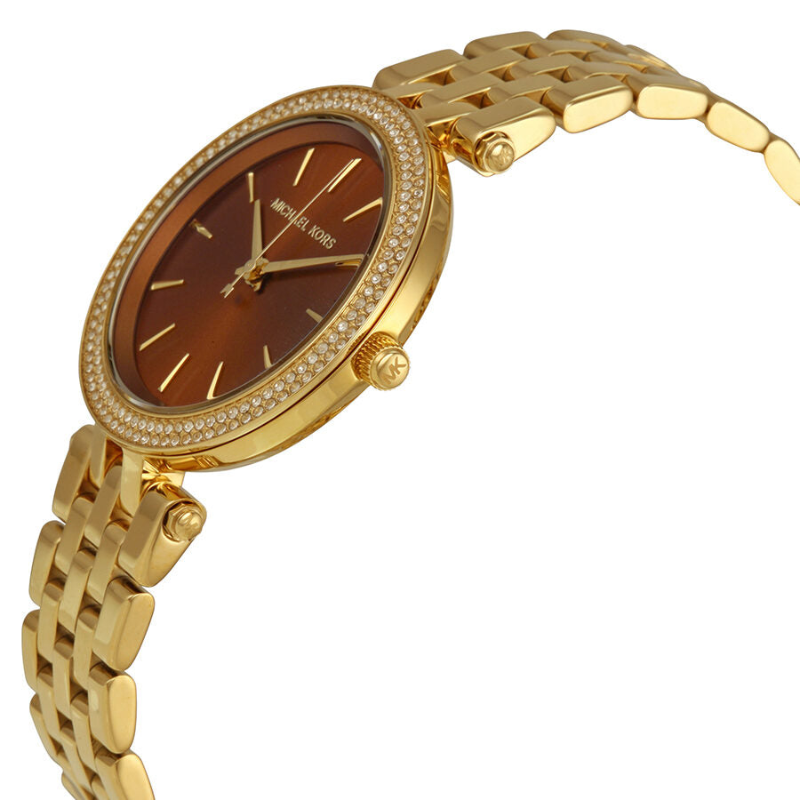 Michael Kors Darci Mini watch at angle showing gold-tone case and strap