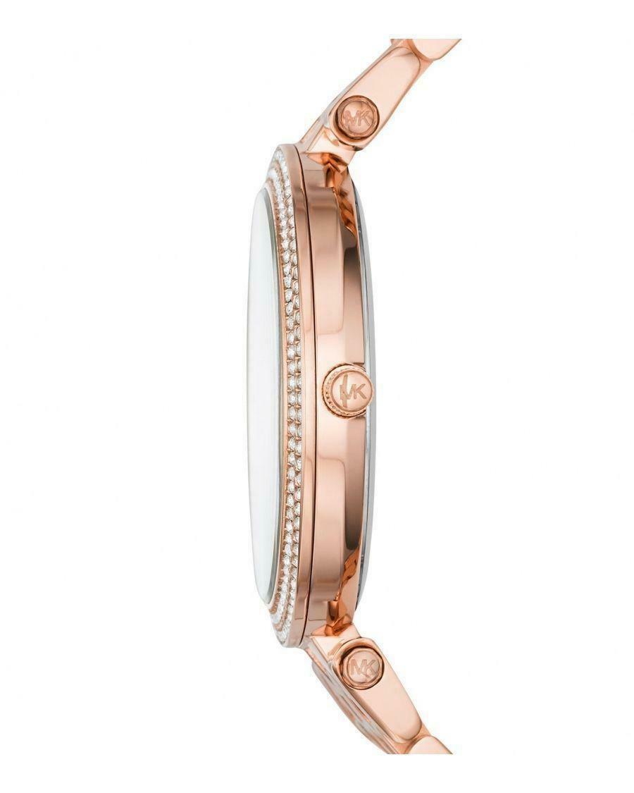 Side profile of Michael Kors Darci watch showing rose gold case thickness and crystal-set bezel