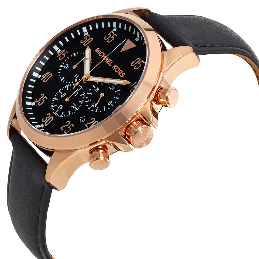 Michael Kors Gage chronograph watch displayed at angle showing rose gold case and black leather strap