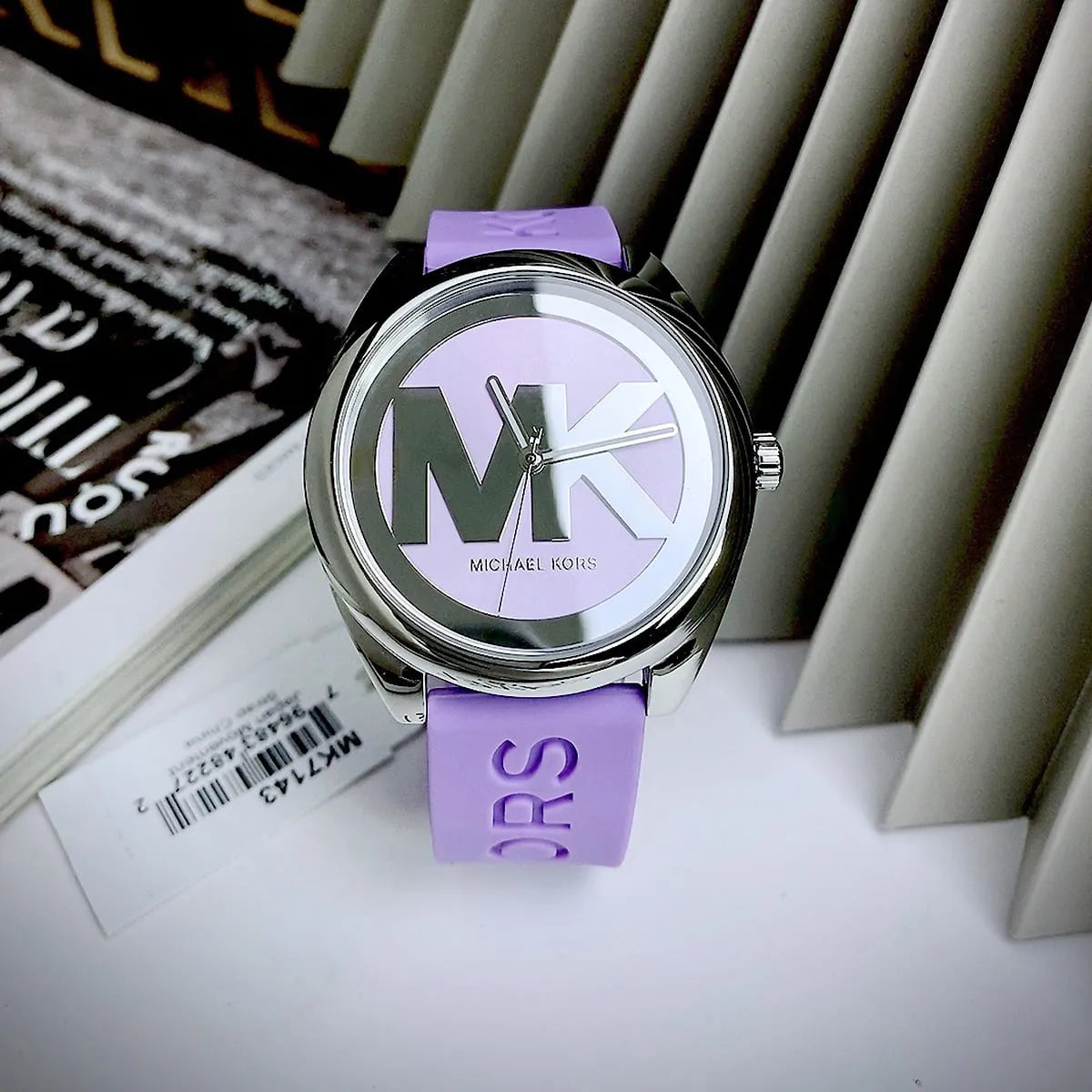 Michael Kors Janelle MK7143 watch at angle showing three-hand dial face