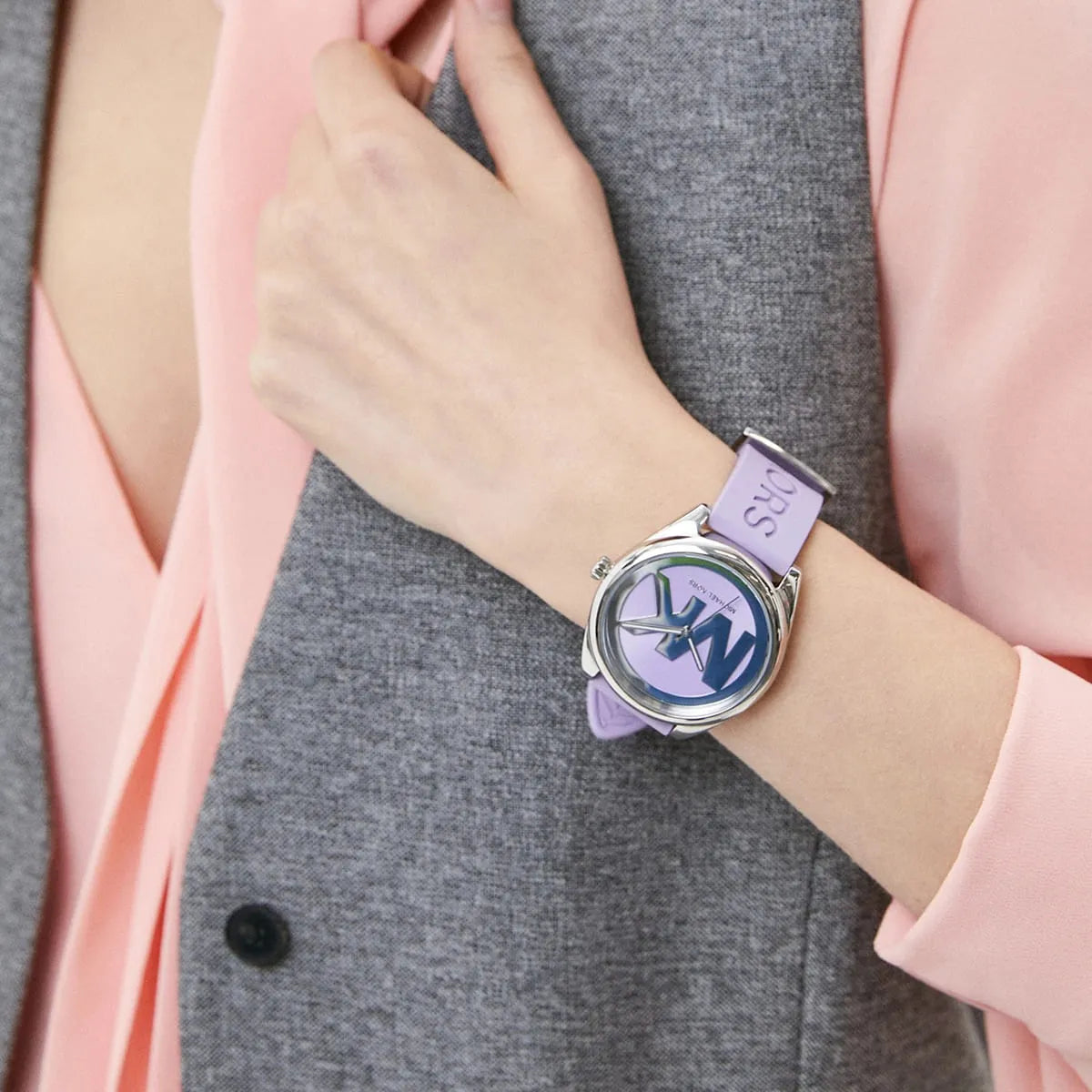 Janelle MK7143 watch with purple dial on wrist, three-hand movement visible